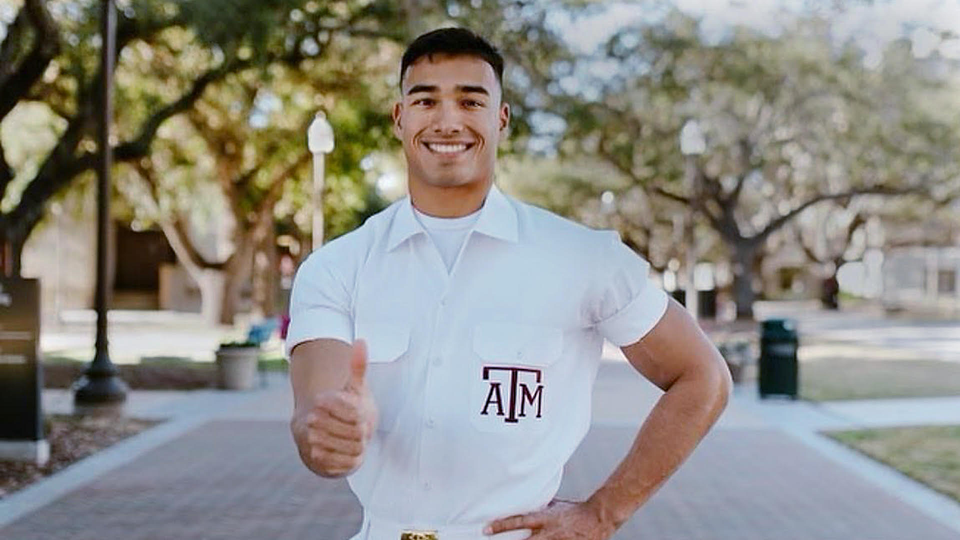 Yell Leader Zac Cross gives the gigs in front of Military Walk.
